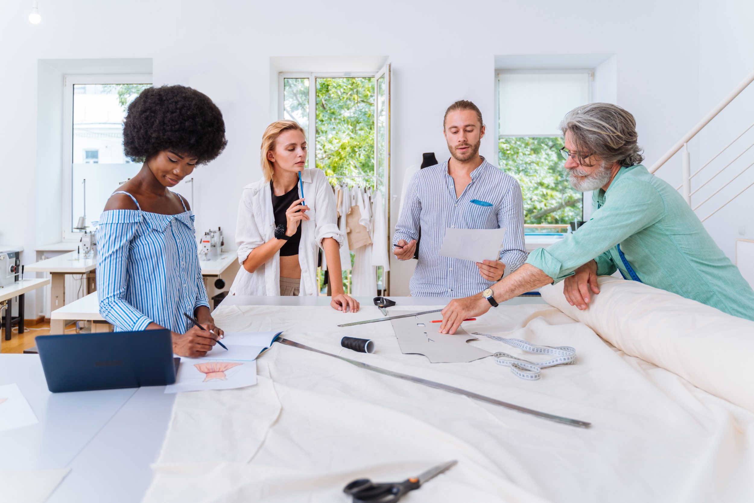 a group of interior designer discussing about the planning as their diploma assignment
